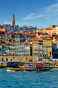 Portugal, Oporto, the Ribeira district and Douro river with a tourist excursion boat ( a converted Port Wine barge ) Portugal, Oporto, the Ribeira district and Douro river with a tourist excursion boat ( a converted Port Wine barge )
